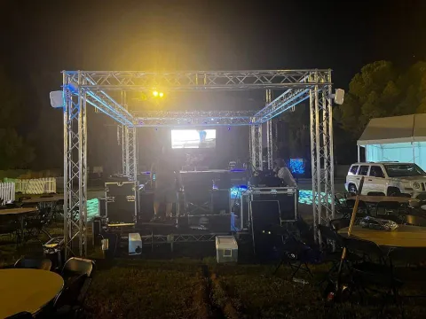 Nighttime festival production truss with stage lighting and event equipment in Southern Nevada